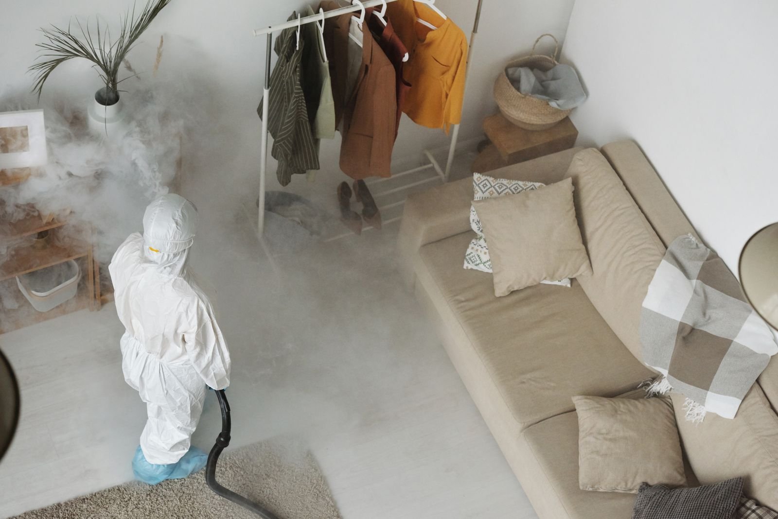 Technician treating the inside of a home